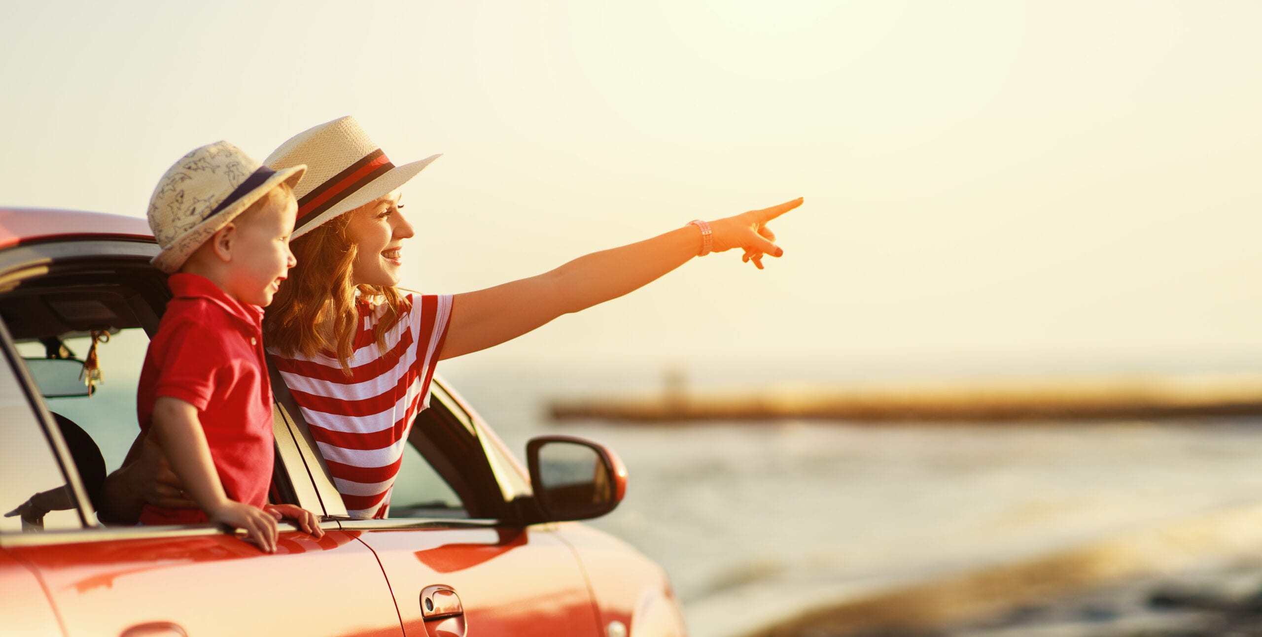 happy family mother and child boy goes to summer travel trip in car